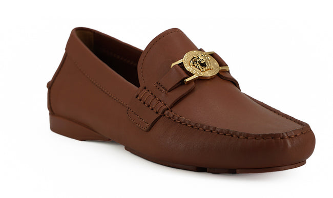 Elegant Medusa-Embossed Leather LoafersEmbrace sophistication with these 100% authentic Versace men’s loafers, perfect for the discerning gentleman. Arriving in pristine condition with original box, tags, and dust bag, these shoes not only promise unparal