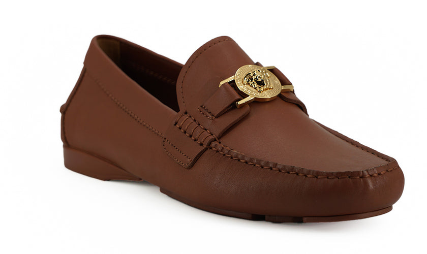 Elegant Medusa-Embossed Leather LoafersEmbrace sophistication with these 100% authentic Versace men’s loafers, perfect for the discerning gentleman. Arriving in pristine condition with original box, tags, and dust bag, these shoes not only promise unparal