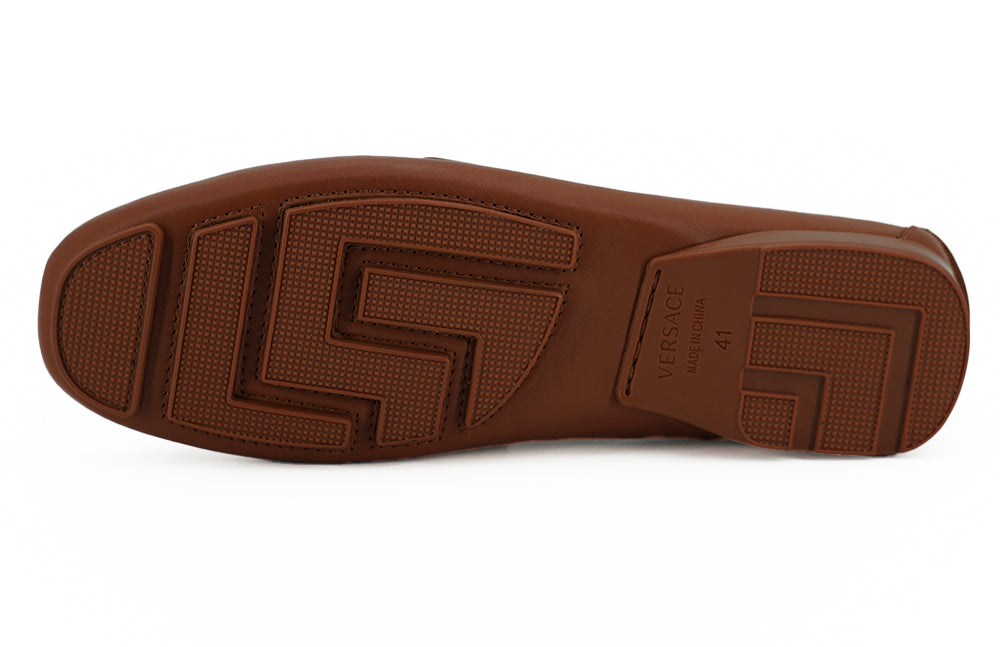 Elegant Medusa-Embossed Leather LoafersEmbrace sophistication with these 100% authentic Versace men’s loafers, perfect for the discerning gentleman. Arriving in pristine condition with original box, tags, and dust bag, these shoes not only promise unparal