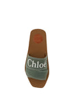 Elegant Forest Green Cotton SlidesStep into comfort and luxury with these exquisite Chloé slides, perfect for the discerning fashionista. Boasting a fresh Forest Green hue, these sandals marry style and comfort seamlessly. Designed with a chic open square