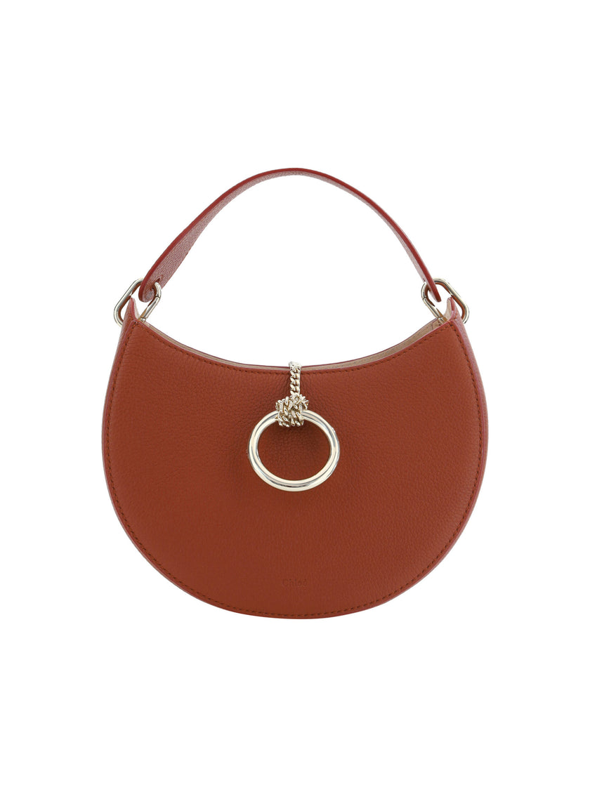 Sepia Brown Small Arlène Leather Shoulder BagDiscover the epitome of elegance with the Chloé Small Arlène Shoulder Bag. This stunning accessory in sepia brown is a sleek addition to any wardrobe, blending timeless style with modern sensibilities. Complete