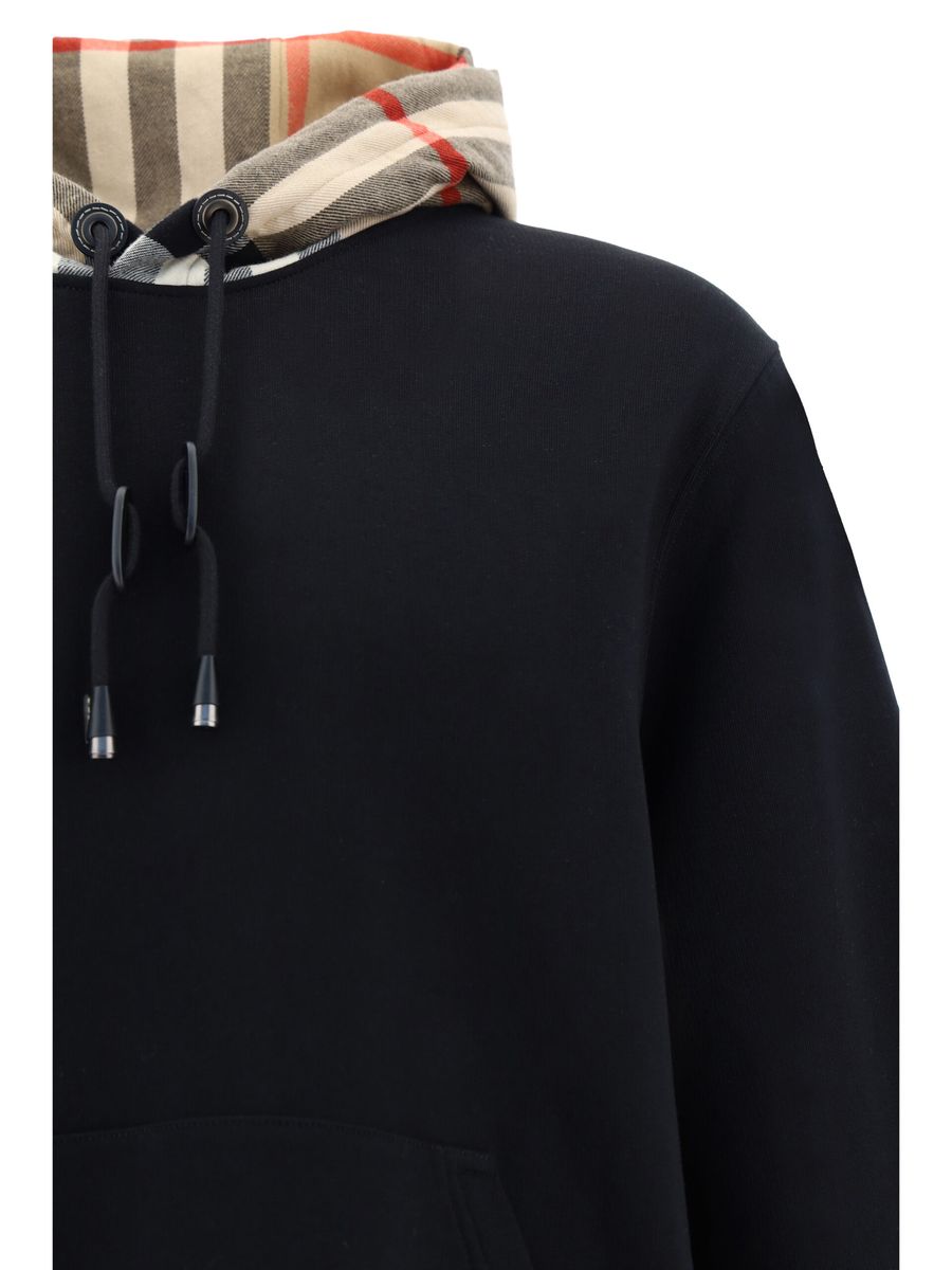 Elegant Oversize Black Samuel HoodieDiscover the epitome of comfort infused with the quintessential touch of luxury with this Burberry Samuel Hoodie. Tailored to exude style, this hoodie features a drawstring hood for a personalized fit and is accented wi
