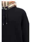 Elegant Oversize Black Samuel HoodieDiscover the epitome of comfort infused with the quintessential touch of luxury with this Burberry Samuel Hoodie. Tailored to exude style, this hoodie features a drawstring hood for a personalized fit and is accented wi