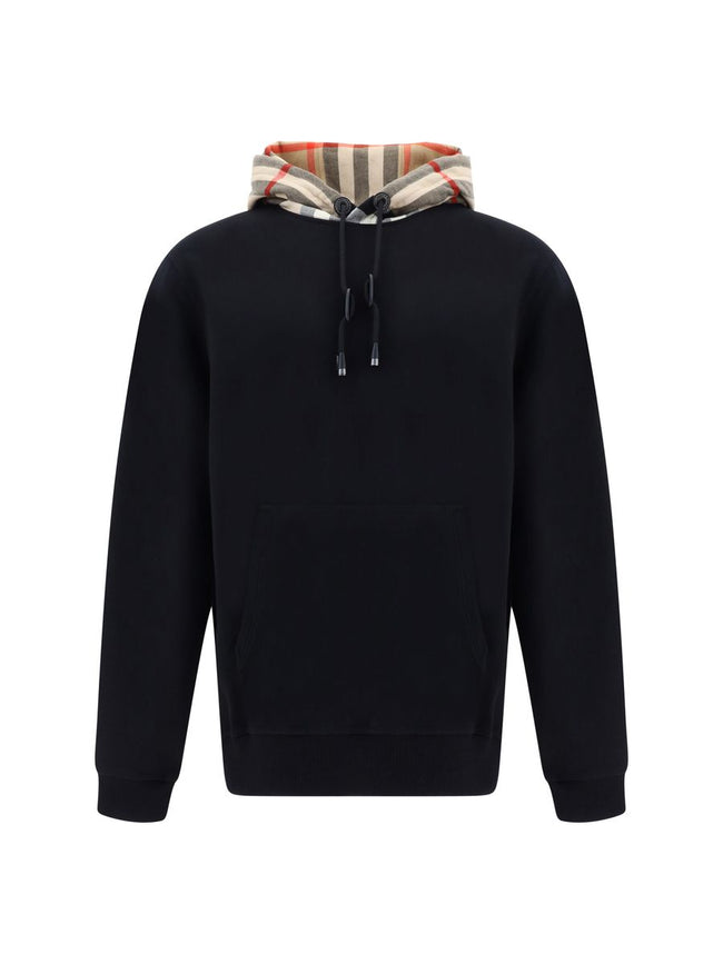 Elegant Oversize Black Samuel HoodieDiscover the epitome of comfort infused with the quintessential touch of luxury with this Burberry Samuel Hoodie. Tailored to exude style, this hoodie features a drawstring hood for a personalized fit and is accented wi