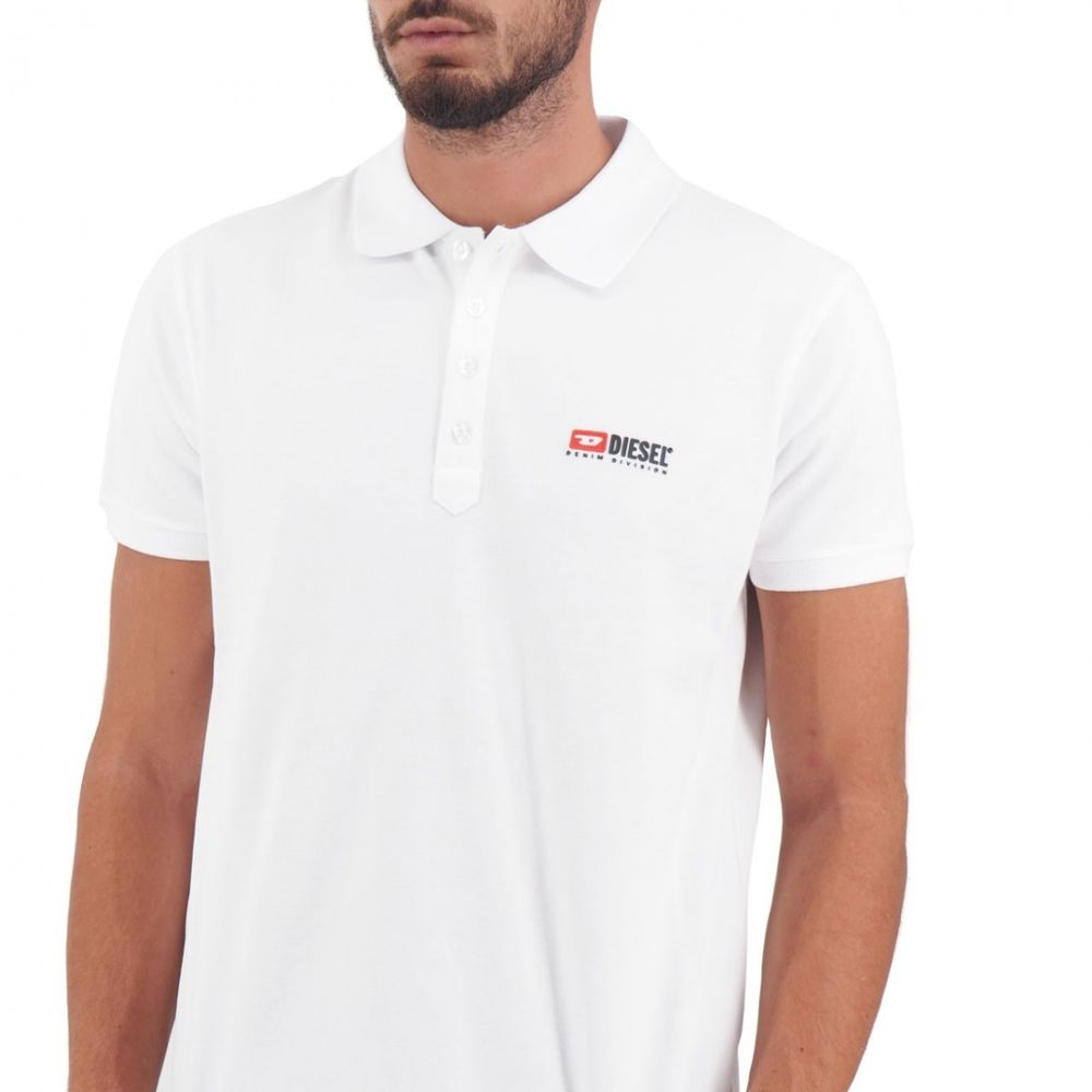 Elegant White Cotton Polo Shirt with Contrasting LogoDiscover the epitome of casual sophistication with our Diesel white cotton polo shirt. A versatile addition to your wardrobe, this polo exudes elegance with a contrasting logo detail on the front and a
