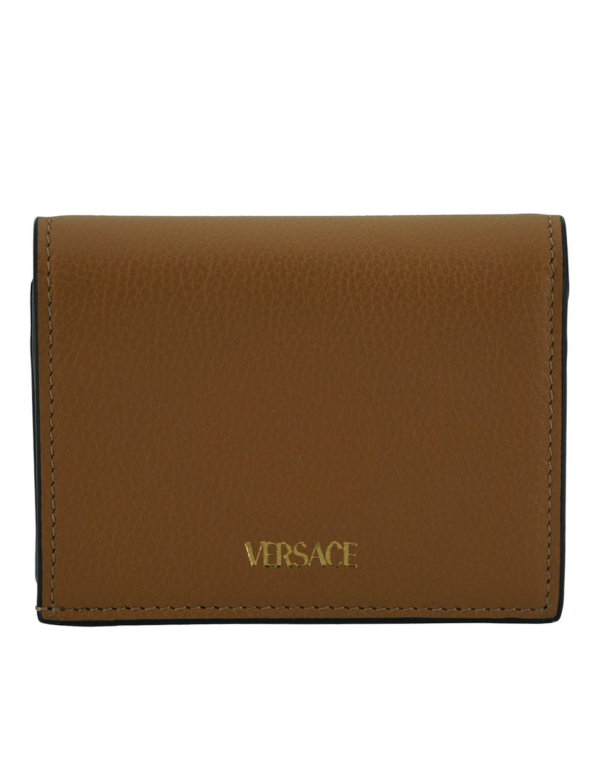 Elegant Compact Leather Wallet in BrownIndulge in the luxury of a Versace compact wallet, a sophisticated accessory that blends functionality with high fashion. Known for its exquisite Italian craftsmanship, this compact wallet is perfect for the chic ind