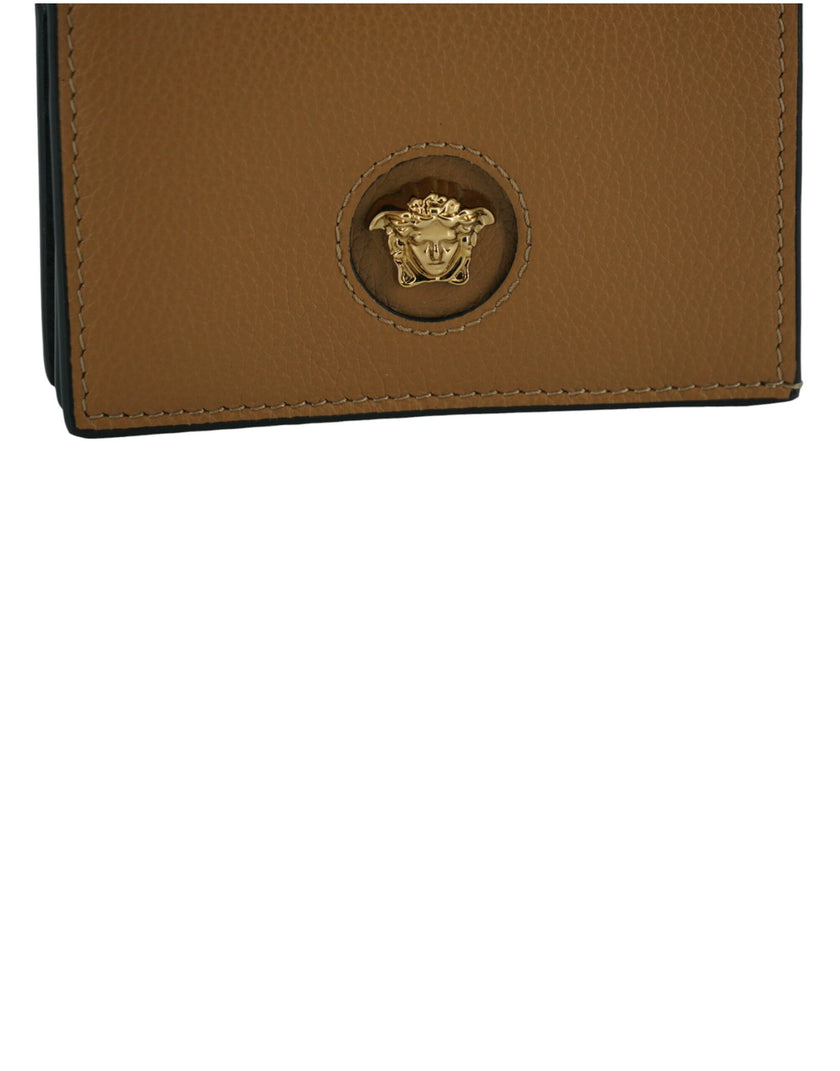 Elegant Compact Leather Wallet in BrownIndulge in the luxury of a Versace compact wallet, a sophisticated accessory that blends functionality with high fashion. Known for its exquisite Italian craftsmanship, this compact wallet is perfect for the chic ind