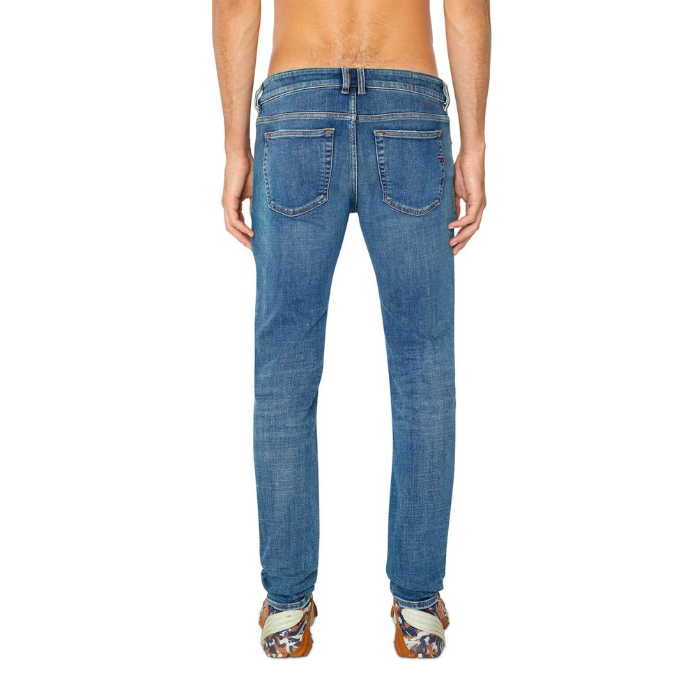 Blue Cotton Men Skinny JeanUnleash your rockstar edge with the Diesel Skinny jeans, artfully crafted with rebellion at their core. Featuring a low waist and a sleek narrow leg from thigh to ankle, these skinnies are made for those who dare to stand out. C