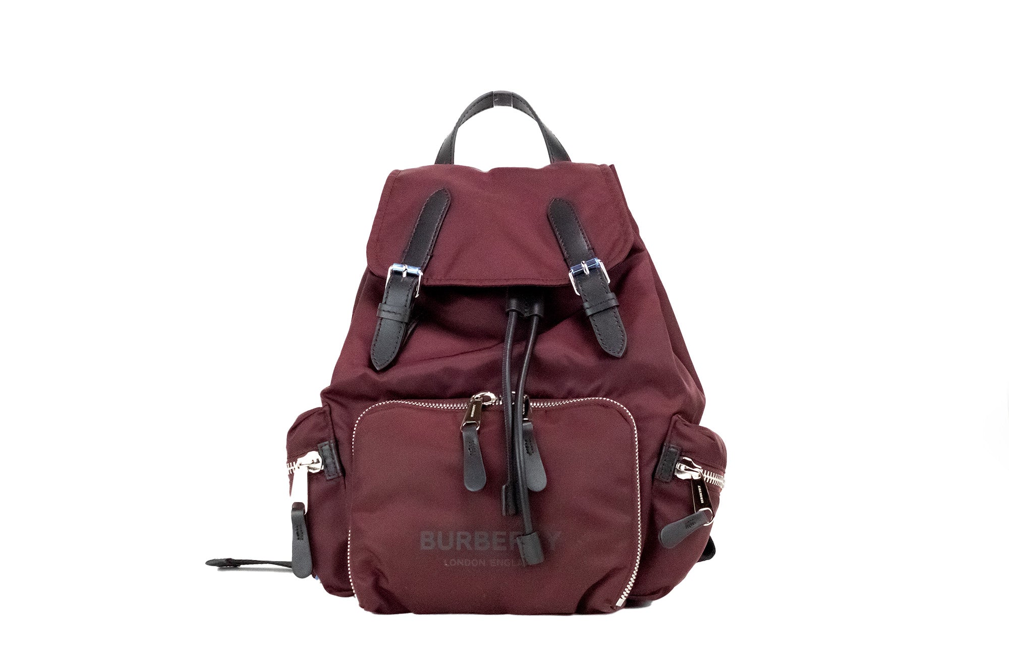 Medium Burgundy Econyl Nylon Rucksack Drawstring Backpack BookbagStyle: Burberry Medium Drawstring Flap Rucksack Bag (Burgundy) Material: Nylon (Burberry Econyl) Features: Drawstring Flap Closure, Adjustable Shoulder Straps, Top Handle, Outer Zip Pockets
