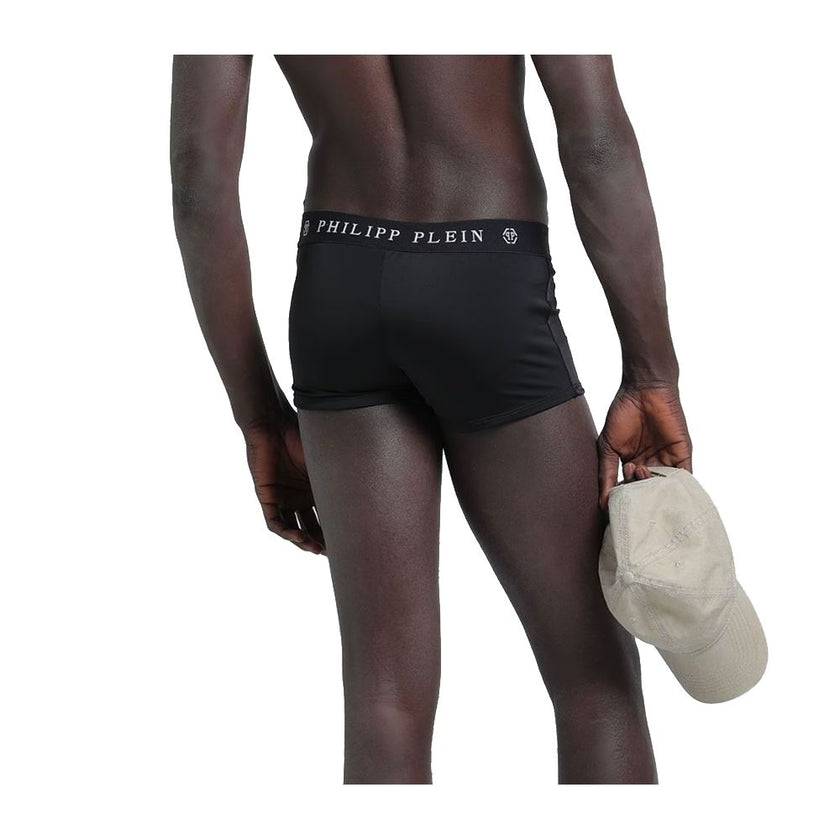 Black Polyamide Men's SwimwearEmbrace the essence of audacious luxury with this Philipp Plein men’s boxer swimwear. Crafted with a perfect blend of polyamide and elastane, it offers an impeccable fit and unwavering comfort. The bold black hue is accentuat