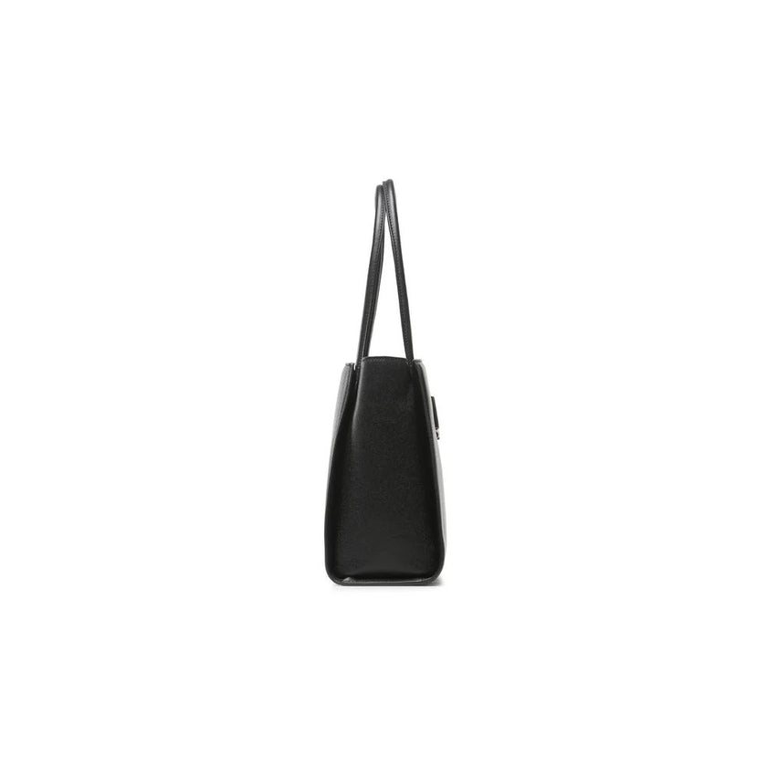 Chic Ebony Tote with Silver Logo AccentIndulge in the perfect blend of luxury and athleticism with the Plein Sport tote bag. Fashioned from durable eco-leather, this exquisite shopping companion boasts a striking silver-toned rubber logo that captures the