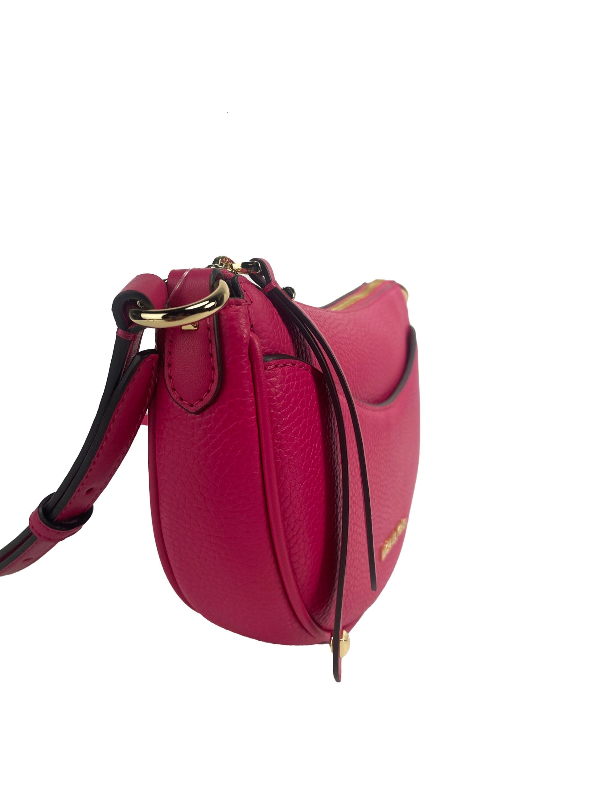 Dover Small Pink Half Moon Crossbody Bag PurseStyle: Michael Kors Dover Small Half Moon Crossbody Bag (Electric Pink) Material: Pebbled Leather Features: 3 Inner Card Slots, Adjustable Crossbody Strap, Jacquard Lining, Zip Closure, Outer Slip Pocket Measu