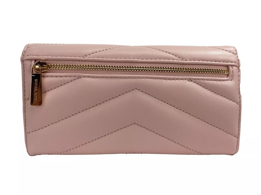 Jet Set Travel Large Quilted Leather Trifold Wallet Powder BlushStyle: Michael Kors Jet Set Travel Large Quilted Trifold Wallet (Powder Blush) Material: Leather Features: Flap with Button Closure, Photo ID Holder, 7 Card Slots Measures: 17.78 cm L x 10.16