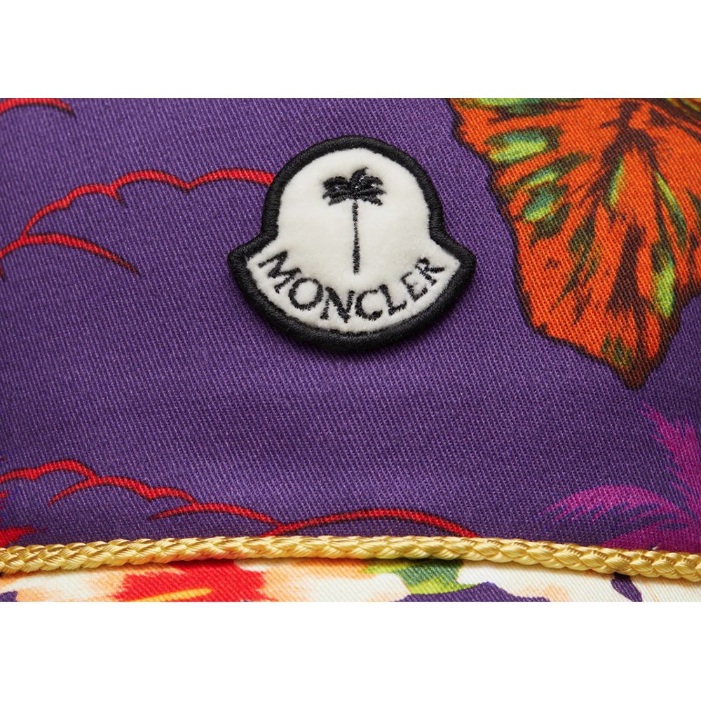 Purple Cotton Men CapElevate your headwear collection with the Moncler x Palm Angels baseball cap, where high fashion meets streetwear cool. This cap boasts a vivid floral print set against a rich purple backdrop that makes a bold statement. Adorned with
