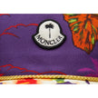 Purple Cotton Men CapElevate your headwear collection with the Moncler x Palm Angels baseball cap, where high fashion meets streetwear cool. This cap boasts a vivid floral print set against a rich purple backdrop that makes a bold statement. Adorned with