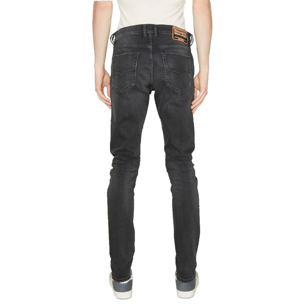 Black Cotton Men JeansTransform your wardrobe with the ultimate blend of comfort and style in these Diesel jeans. Crafted from premium cotton with just the right touch of elastane for a slight stretch, these faded black jeans are a must-have for any fashi
