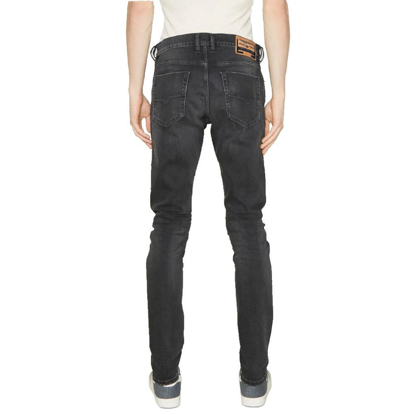 Black Cotton Men JeansTransform your wardrobe with the ultimate blend of comfort and style in these Diesel jeans. Crafted from premium cotton with just the right touch of elastane for a slight stretch, these faded black jeans are a must-have for any fashi