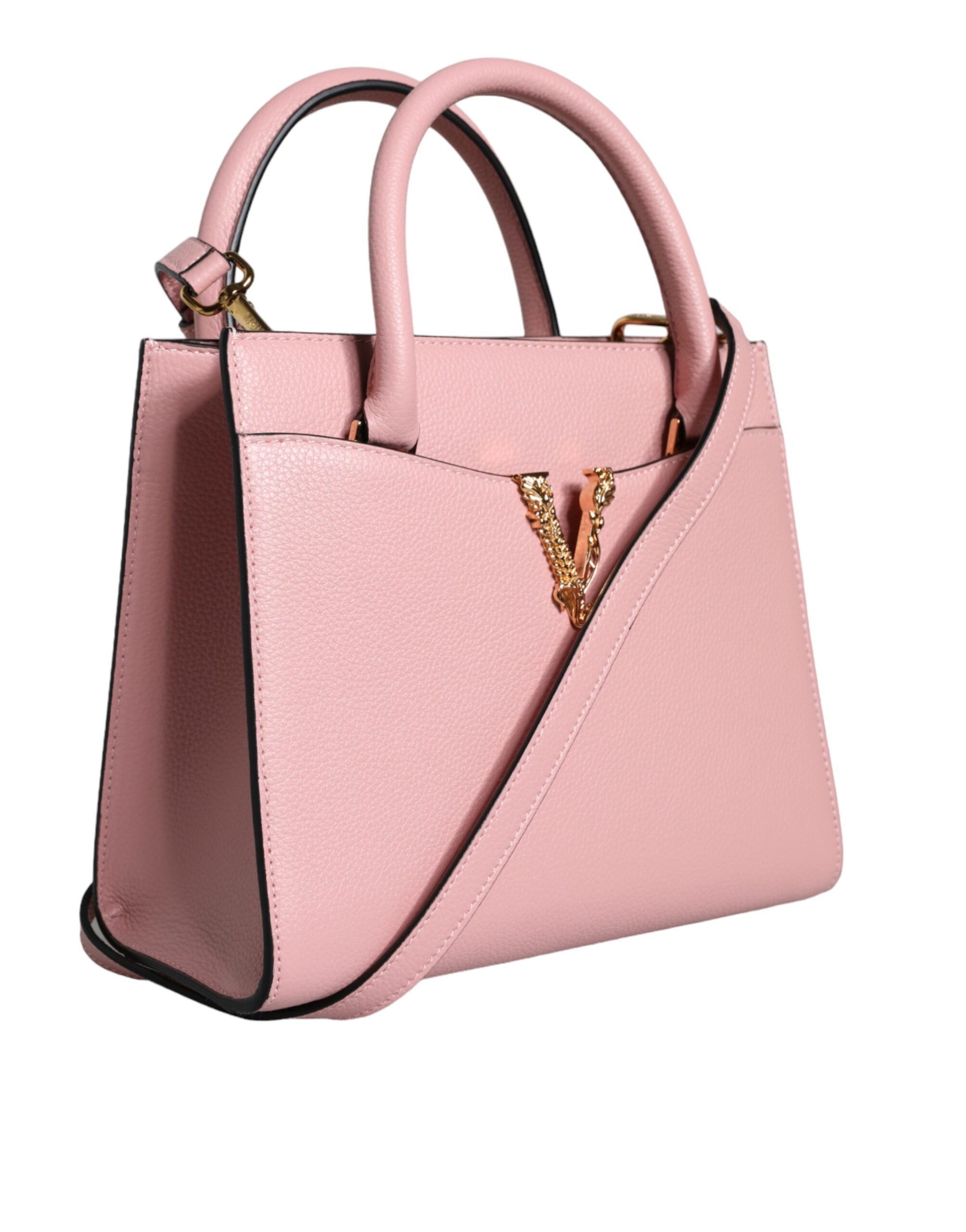 Pink Small Top Handle Grainy Calf Leather Crossbody BagVERSACE Absolutely stunning, 100% Authentic, brand new with tags VERSACE bags. Brand logo, solid color, crossbody strap, magnetic fastening. Model: Crossbody bag Material: 100% VL, 100% CO Colour: Pin