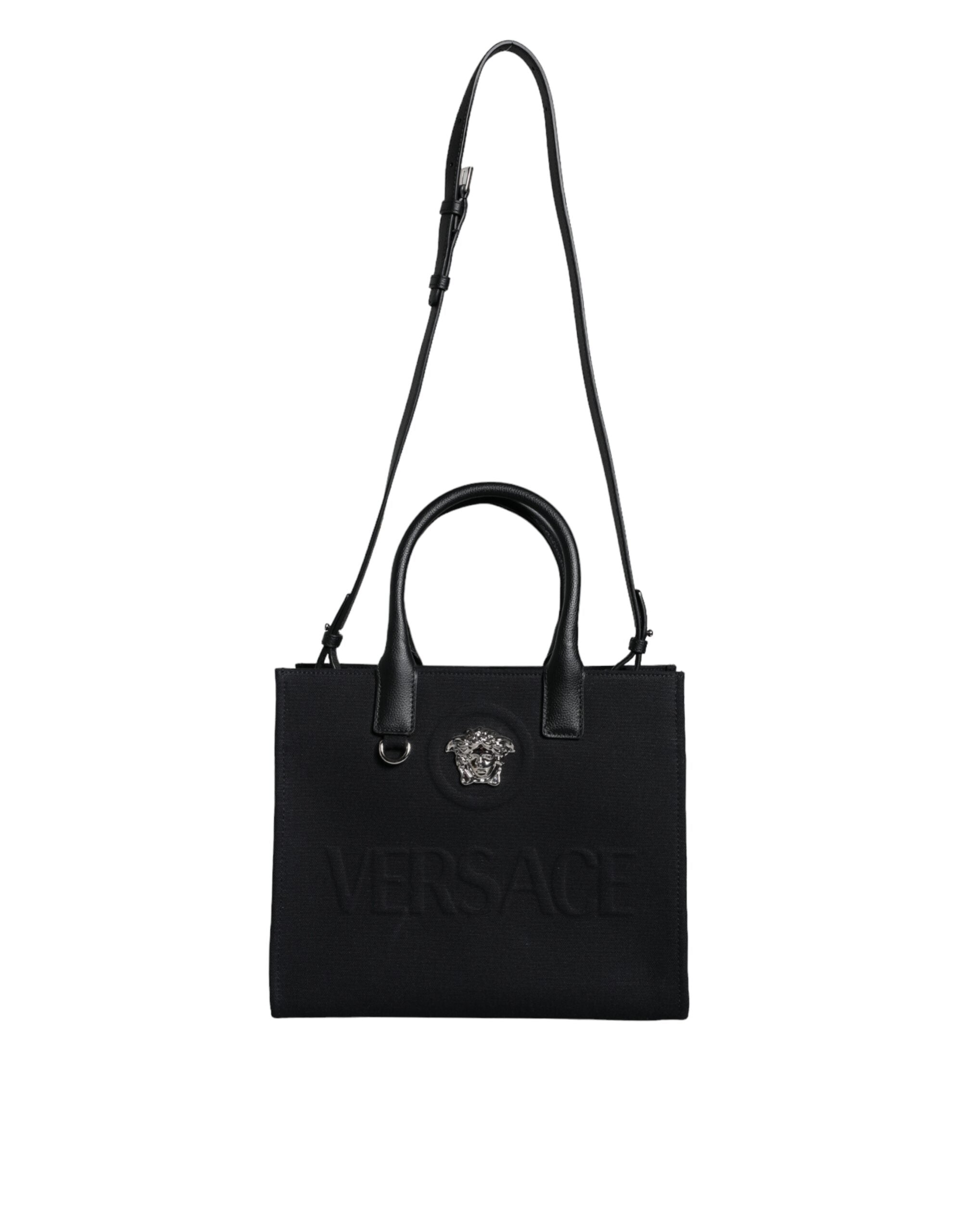 Black Top Handle Canvas Leather Logo Crossbody Tote BagVERSACE Absolutely stunning, 100% Authentic, brand new with tags VERSACE bags. Brand logo, solid color, crossbody strap, snap button fastening. Model: Crossbody bag Material: 100% VL, 100% CO Colour: