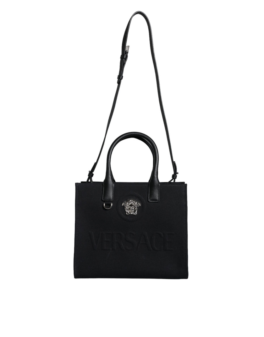 Black Top Handle Canvas Leather Logo Crossbody Tote BagVERSACE Absolutely stunning, 100% Authentic, brand new with tags VERSACE bags. Brand logo, solid color, crossbody strap, snap button fastening. Model: Crossbody bag Material: 100% VL, 100% CO Colour: