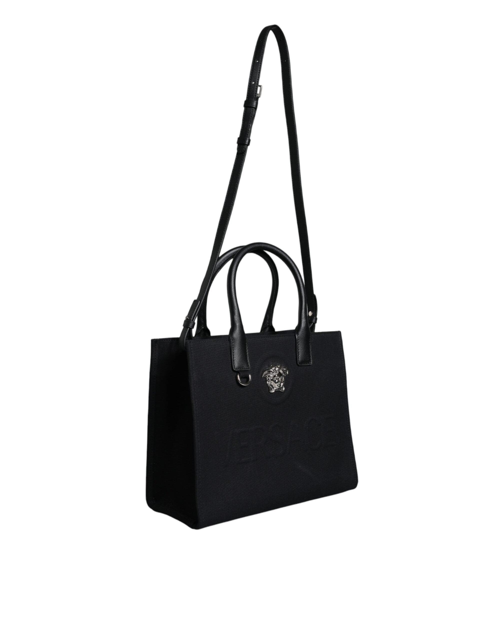 Black Top Handle Canvas Leather Logo Crossbody Tote BagVERSACE Absolutely stunning, 100% Authentic, brand new with tags VERSACE bags. Brand logo, solid color, crossbody strap, snap button fastening. Model: Crossbody bag Material: 100% VL, 100% CO Colour: