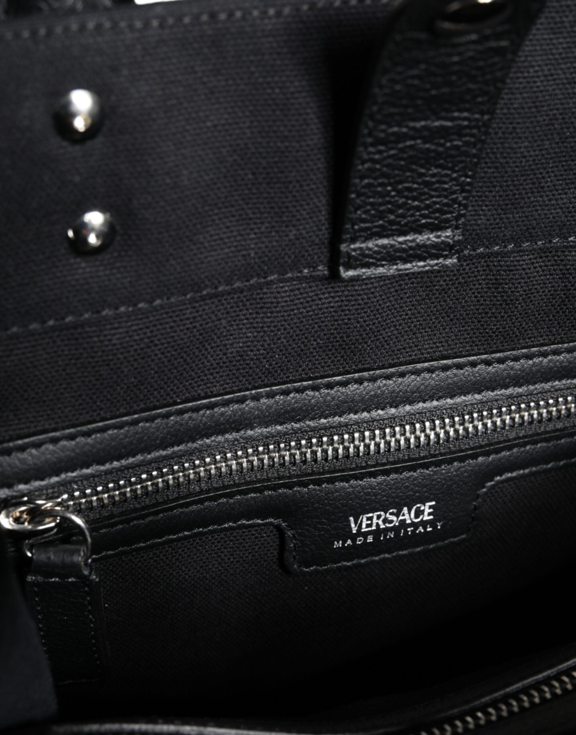 Black Top Handle Canvas Leather Logo Crossbody Tote BagVERSACE Absolutely stunning, 100% Authentic, brand new with tags VERSACE bags. Brand logo, solid color, crossbody strap, snap button fastening. Model: Crossbody bag Material: 100% VL, 100% CO Colour: