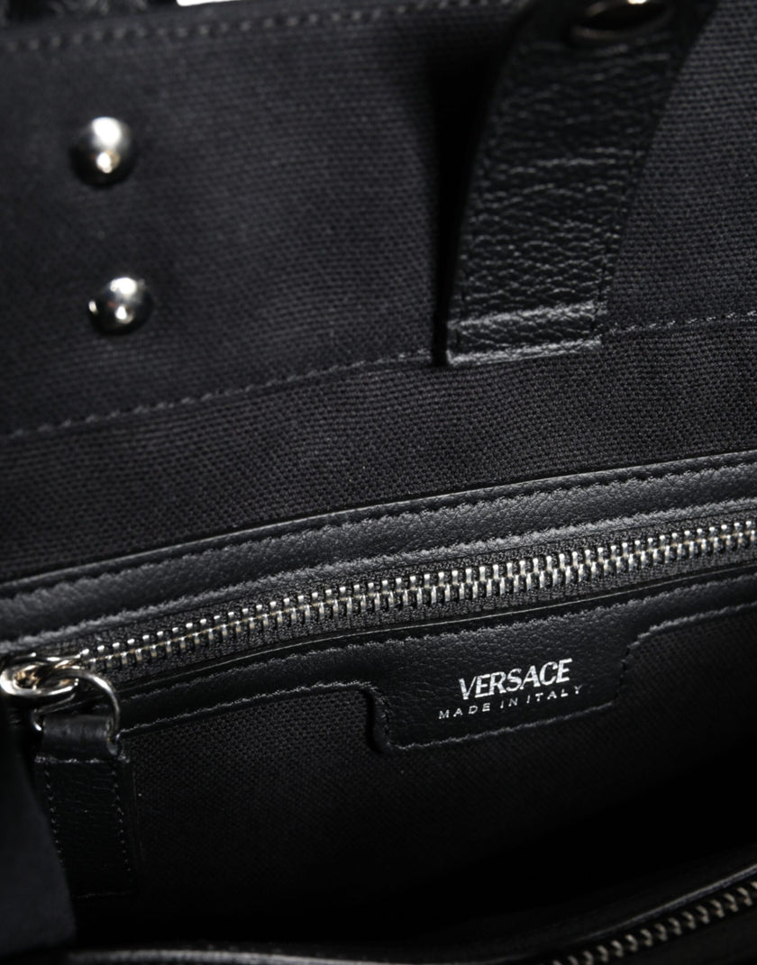 Black Top Handle Canvas Leather Logo Crossbody Tote BagVERSACE Absolutely stunning, 100% Authentic, brand new with tags VERSACE bags. Brand logo, solid color, crossbody strap, snap button fastening. Model: Crossbody bag Material: 100% VL, 100% CO Colour: