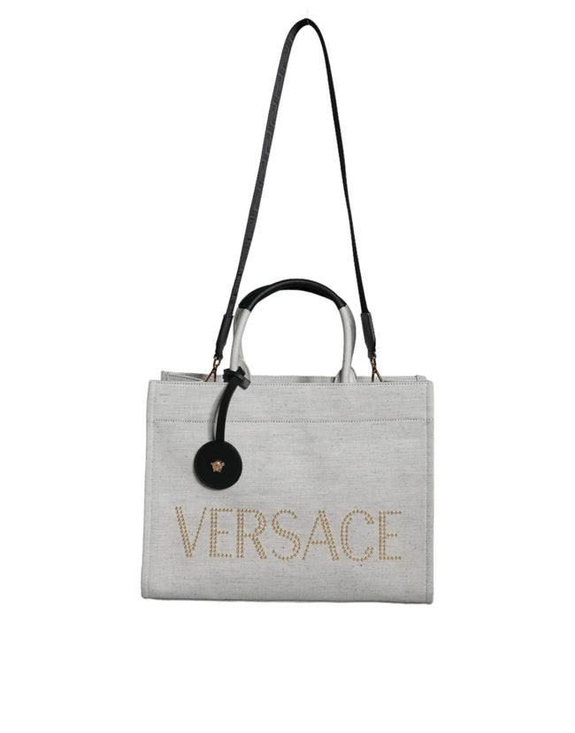 White Top Handle Canvas Leather Logo Crossbody Tote BagVERSACE Absolutely stunning, 100% Authentic, brand new with tags VERSACE tote bags. Brand logo, solid color, crossbody strap. Model: Tote bag Material: VL100%, WV66% VI19% PA10% WS5% Color: White, Bla