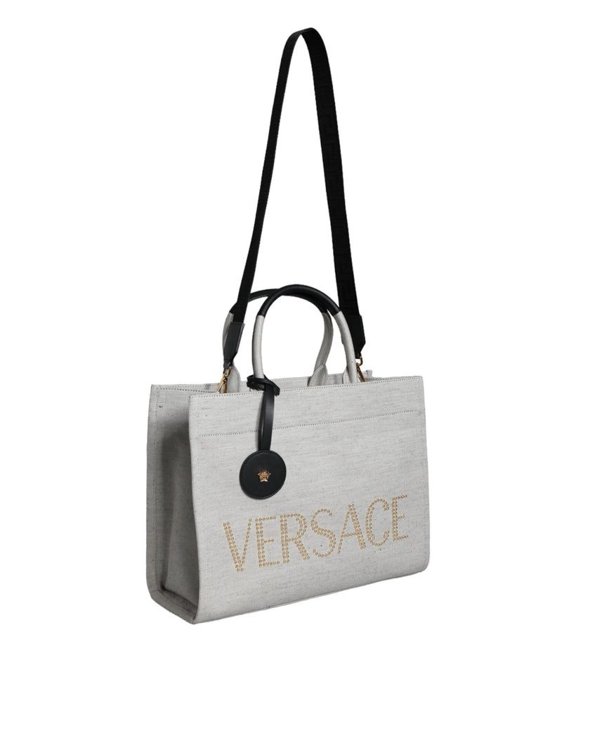 White Top Handle Canvas Leather Logo Crossbody Tote BagVERSACE Absolutely stunning, 100% Authentic, brand new with tags VERSACE tote bags. Brand logo, solid color, crossbody strap. Model: Tote bag Material: VL100%, WV66% VI19% PA10% WS5% Color: White, Bla