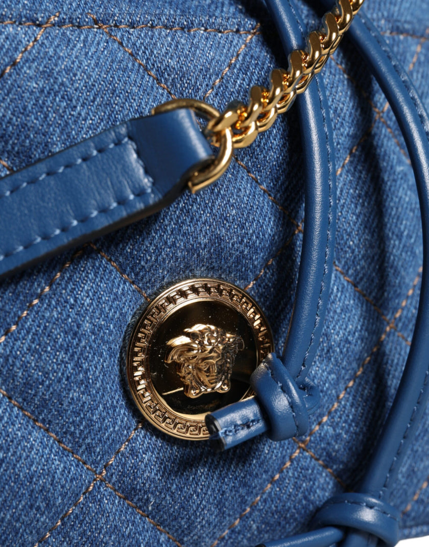 Blue Quilted Denim Leather Crossbody Shoulder BagVERSACE Absolutely stunning, 100% Authentic, brand new with tags VERSACE bags. Brand logo, solid color, crossbody strap. Model: Crossbody bag Material: VL100%, CO60% VI40% Colour: Blue Black inner lining wi