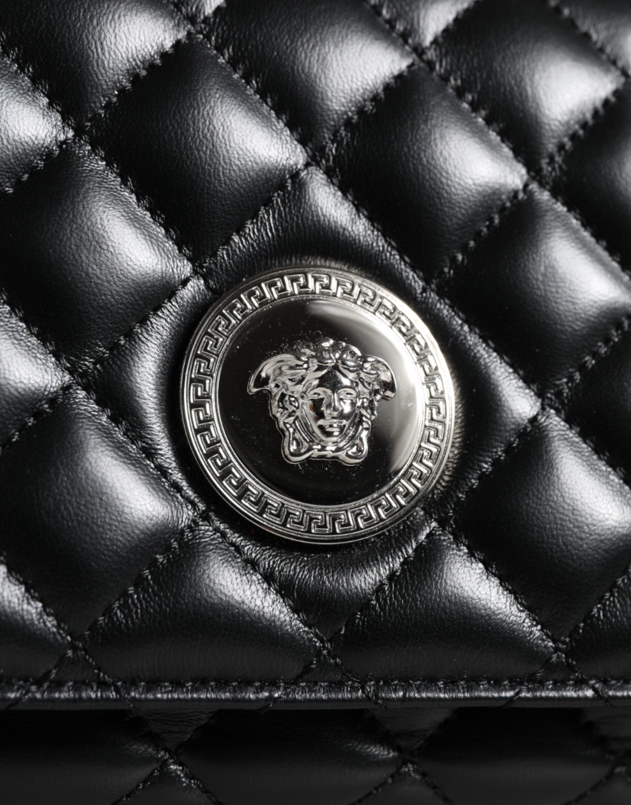 Black Quilted Lambskin Leather Crossbody Shoulder BagVERSACE Absolutely stunning, 100% Authentic, brand new with tags VERSACE bags. Brand logo, solid color, crossbody strap. Model: Crossbody bag Material: AOS100%, CO60% VI40% Colour: Black Fabric inner li