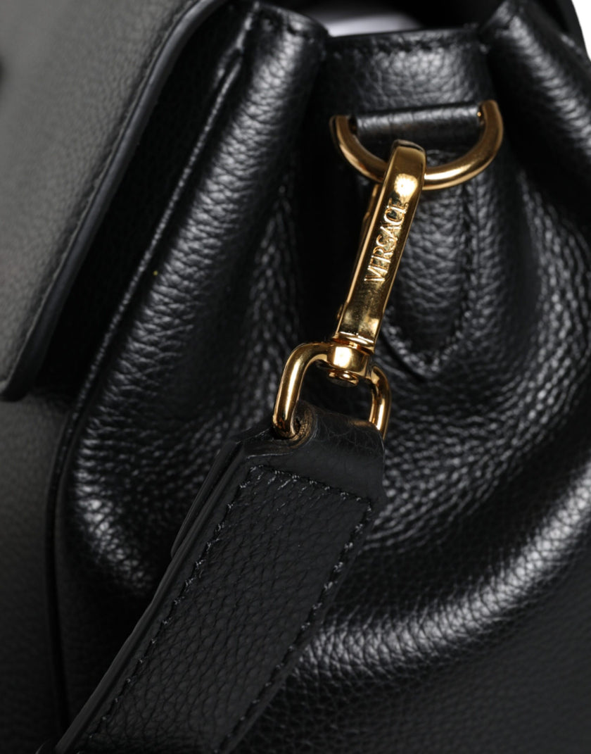 Black Top Handle Grainy Calfskin Leather Crossbody BagVERSACE Absolutely stunning, 100% Authentic, brand new with tags VERSACE bags. Brand logo, solid color, crossbody strap, magnetic fastening. Model: Crossbody bag Material: VL100%, CO100% Colour: Black