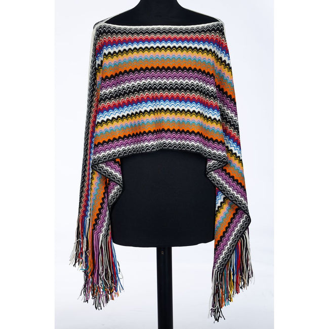Multicolor Wool Women PonchoWrap yourself in the epitome of bohemian elegance with this Missoni fringed poncho. Showcasing the brand’s iconic geometric fantasy in a kaleidoscope of hues, this poncho is a vibrant accessory designed to turn heads. Each swin