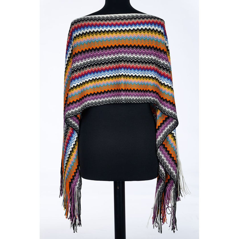 Multicolor Wool Women PonchoWrap yourself in the epitome of bohemian elegance with this Missoni fringed poncho. Showcasing the brand’s iconic geometric fantasy in a kaleidoscope of hues, this poncho is a vibrant accessory designed to turn heads. Each swin