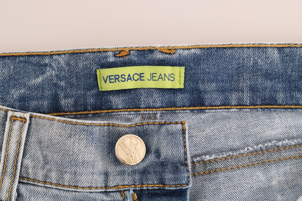 Blue Wash Torn Stretch Slim Fit JeansVERSACE JEANS VJ Absolutely stunning, 100% Authentic, brand new with tags Versace Jeans VJ blue wash and torn cotten stretch jeans. Color: Light blue wash and torn Model: Mid waist slim fit Logo on the back right pocke