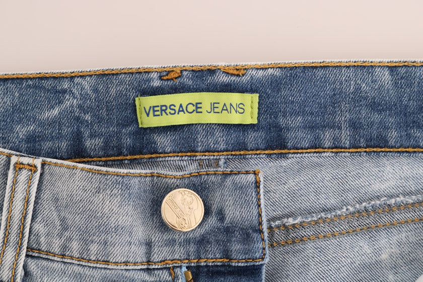 Blue Wash Torn Stretch Slim Fit JeansVERSACE JEANS VJ Absolutely stunning, 100% Authentic, brand new with tags Versace Jeans VJ blue wash and torn cotten stretch jeans. Color: Light blue wash and torn Model: Mid waist slim fit Logo on the back right pocke