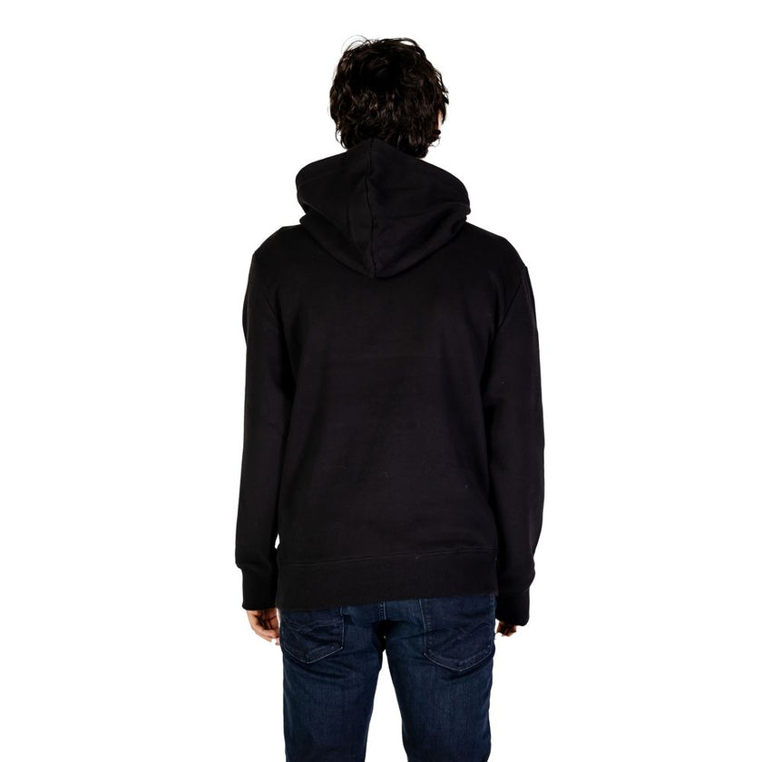 Black Cotton HoodieThe Calvin Klein Jeans CHENILLE MONOLOGO hoodie for men is an essential piece for your wardrobe. Made from 100% cotton, it offers a soft and comfortable feel, perfect for everyday wear. The minimalist design is enhanced by a chenille lo