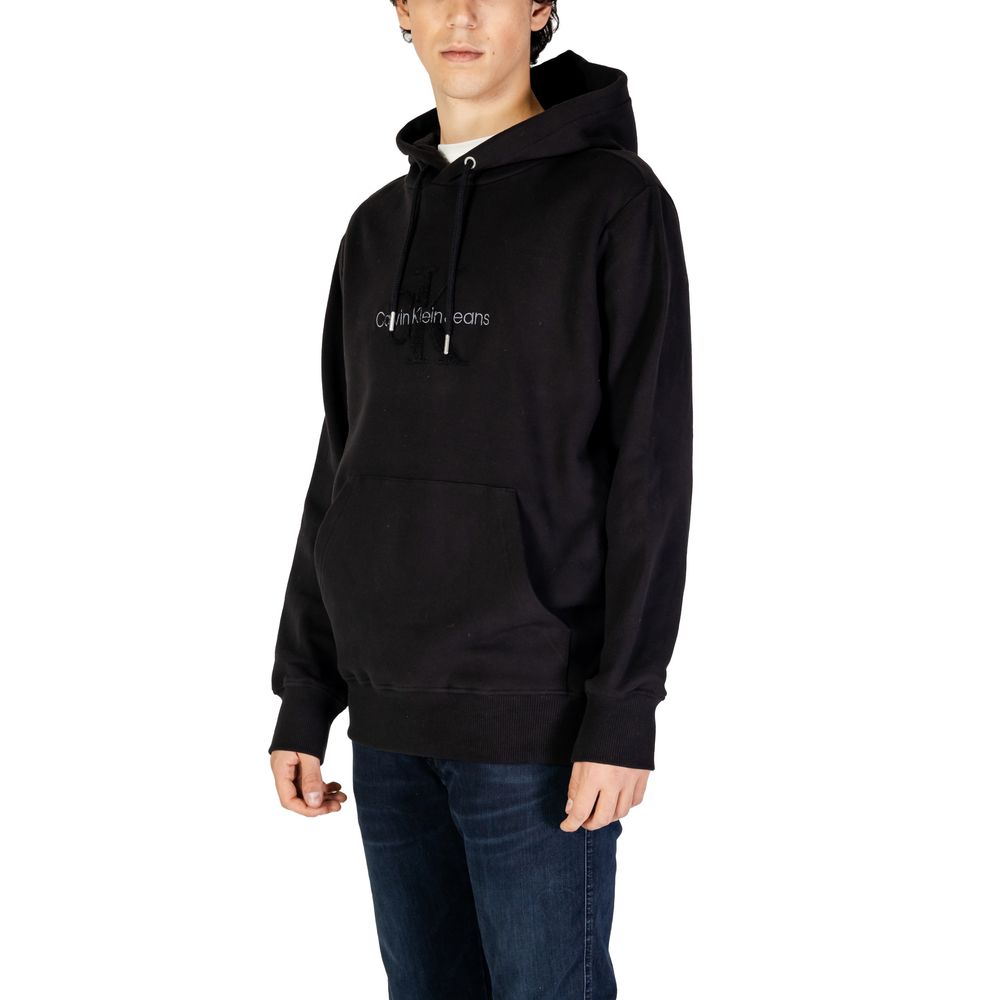 Black Cotton HoodieThe Calvin Klein Jeans CHENILLE MONOLOGO hoodie for men is an essential piece for your wardrobe. Made from 100% cotton, it offers a soft and comfortable feel, perfect for everyday wear. The minimalist design is enhanced by a chenille lo