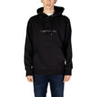 Black Cotton HoodieThe Calvin Klein Jeans CHENILLE MONOLOGO hoodie for men is an essential piece for your wardrobe. Made from 100% cotton, it offers a soft and comfortable feel, perfect for everyday wear. The minimalist design is enhanced by a chenille lo