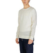 Cream Recycled Wool SportswearThe Calvin Klein MERINO RWS CREW NECK K10K109474 sweater is a must-have for the modern man’s wardrobe. Made from 100% RWS-certified recycled wool, this knitwear offers comfort, softness, and a focus on sustainability. The cla