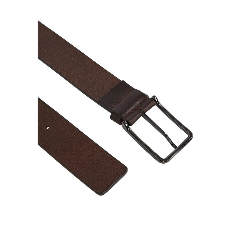 Brown Leather BeltThe Calvin Klein WARMTH 40MM men’s belt, model K50K509759, is a refined accessory crafted from 100% premium leather. Featuring a rectangular polished metal buckle with engraved logo, this belt offers a minimalist and versatile design, pe