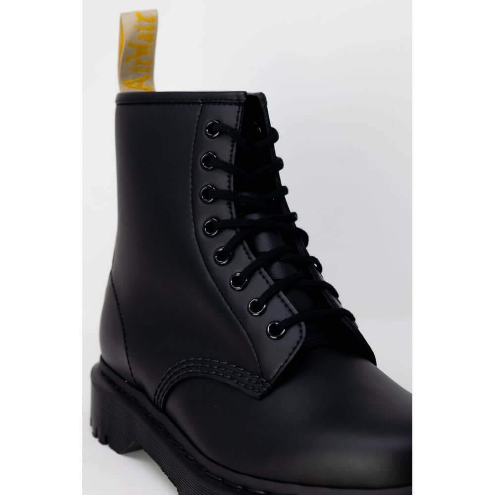 Black Polyester Lace-Up BootsDiscover the Dr. Martens VEGAN 1460 BEX MONO women’s boots, an icon of style and comfort. Made from 100% polyester, these boots are designed to provide a comfortable fit and lasting durability. Featuring a sturdy sole and clas
