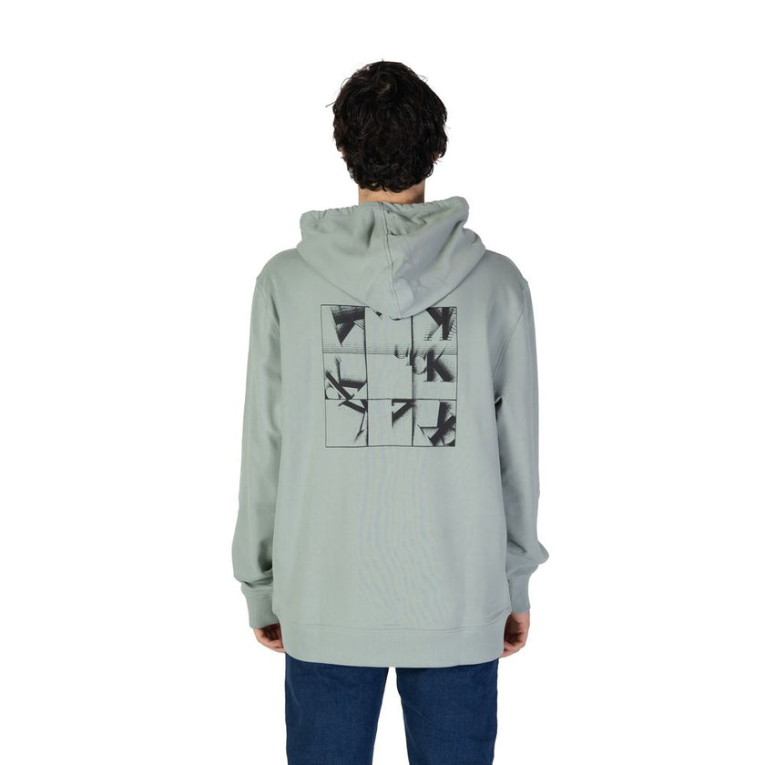 Green Cotton HoodieDiscover the Calvin Klein Jeans GRID MONOGRAM hoodie for men, an essential piece for your wardrobe. Made from 100% cotton, this hoodie offers exceptional comfort and a soft feel against the skin. The modern design is enhanced by the Cal