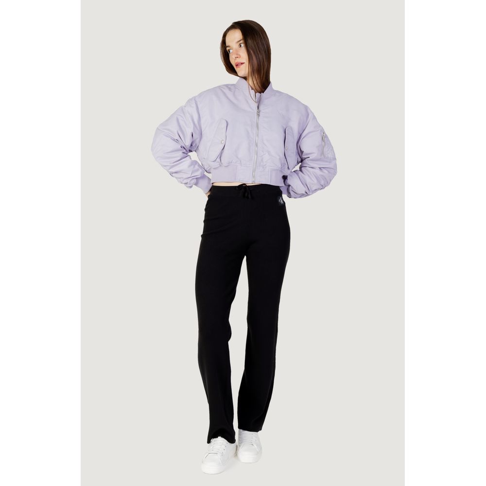 Purple Polyamide Jackets & CoatThe Calvin Klein Jeans LW BOMBER J20J221378 women’s bomber jacket is an iconic piece that combines contemporary style with practicality. Made from 100% polyamide, this jacket features a cropped cut and a slightly oversized f