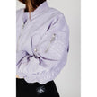 Purple Polyamide Jackets & CoatThe Calvin Klein Jeans LW BOMBER J20J221378 women’s bomber jacket is an iconic piece that combines contemporary style with practicality. Made from 100% polyamide, this jacket features a cropped cut and a slightly oversized f