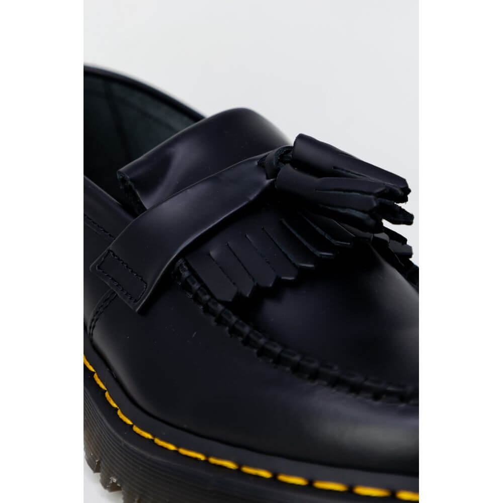 Black Leather Lace-Up BootsThe Dr. Martens Adrian Bex Smooth 26957001 women’s lace-up shoes are an icon of style and attitude. Crafted entirely from high-quality leather, these loafers feature a classic silhouette enhanced by distinctive details such as t