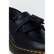 Black Leather Lace-Up BootsThe Dr. Martens Adrian Bex Smooth 26957001 women’s lace-up shoes are an icon of style and attitude. Crafted entirely from high-quality leather, these loafers feature a classic silhouette enhanced by distinctive details such as t
