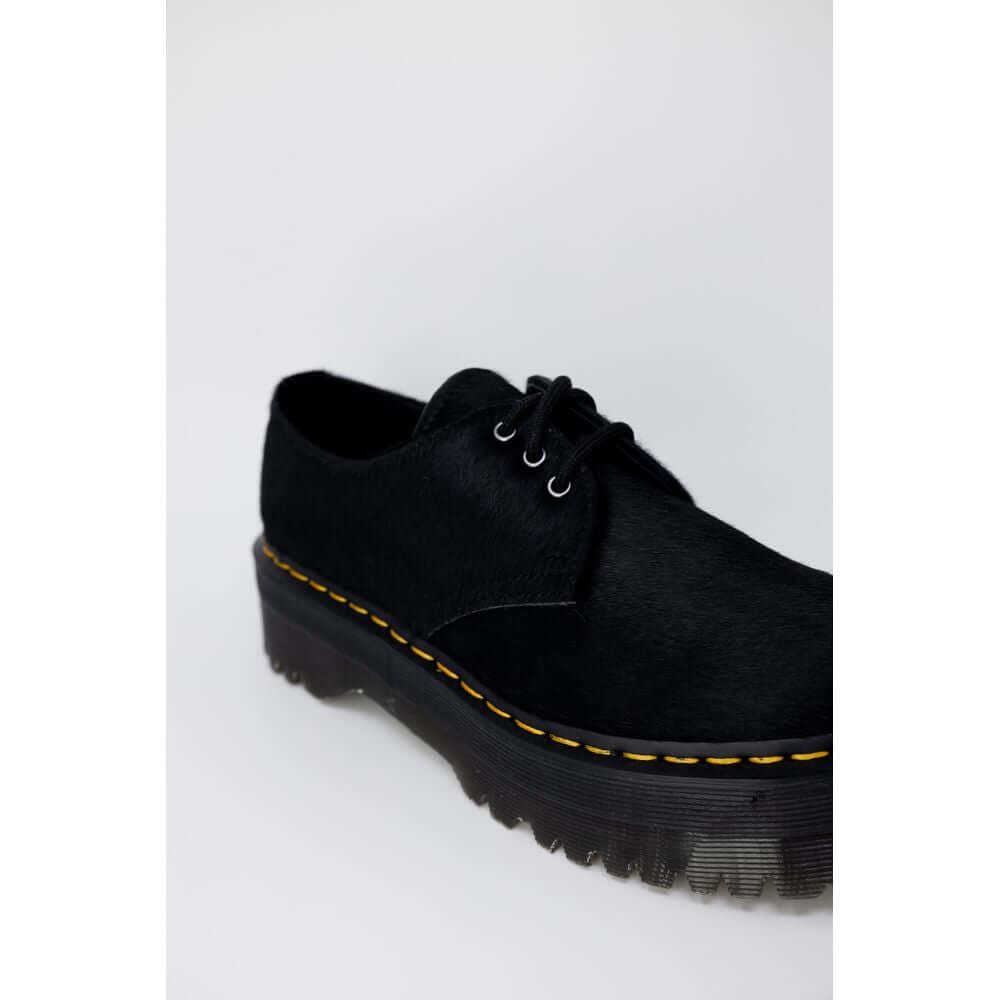 Black Leather Lace-Up BootsThe Dr. Martens 1461 Quad Hair On womenâs lace-up shoes offer a modern twist on an iconic classic. The upper is crafted from 100% high-quality hair-on leather, providing a unique and sophisticated texture. The interior feature