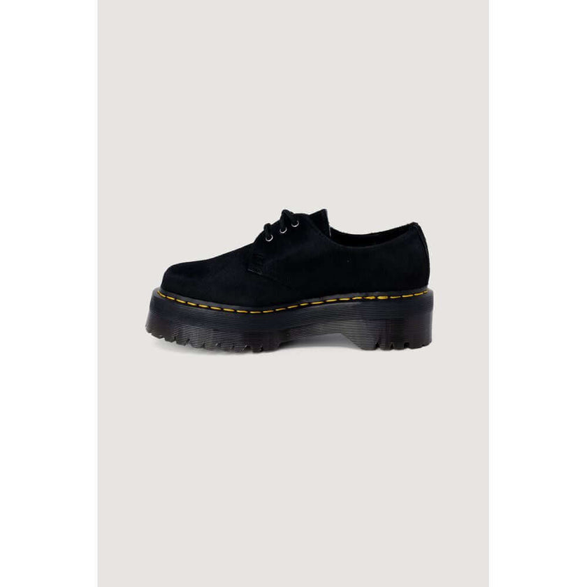Black Leather Lace-Up BootsThe Dr. Martens 1461 Quad Hair On womenâs lace-up shoes offer a modern twist on an iconic classic. The upper is crafted from 100% high-quality hair-on leather, providing a unique and sophisticated texture. The interior feature