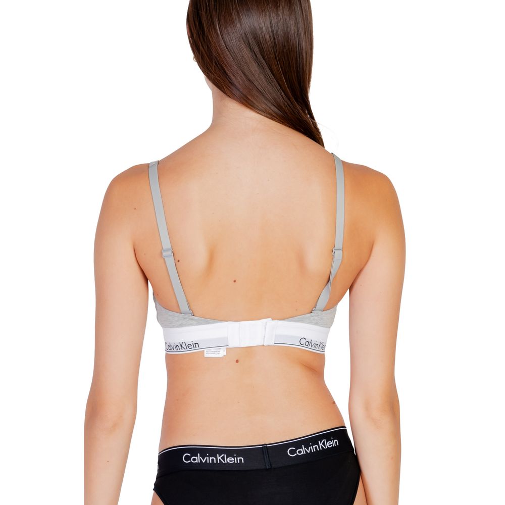 Gray Cotton BraDiscover the lightly lined bralette by Calvin Klein Underwear, an essential piece for your intimate wardrobe. Made with high-quality materials, this bralette consists of 53% cotton, 35% modal, and 12% elastane/lycra, ensuring a comfortable